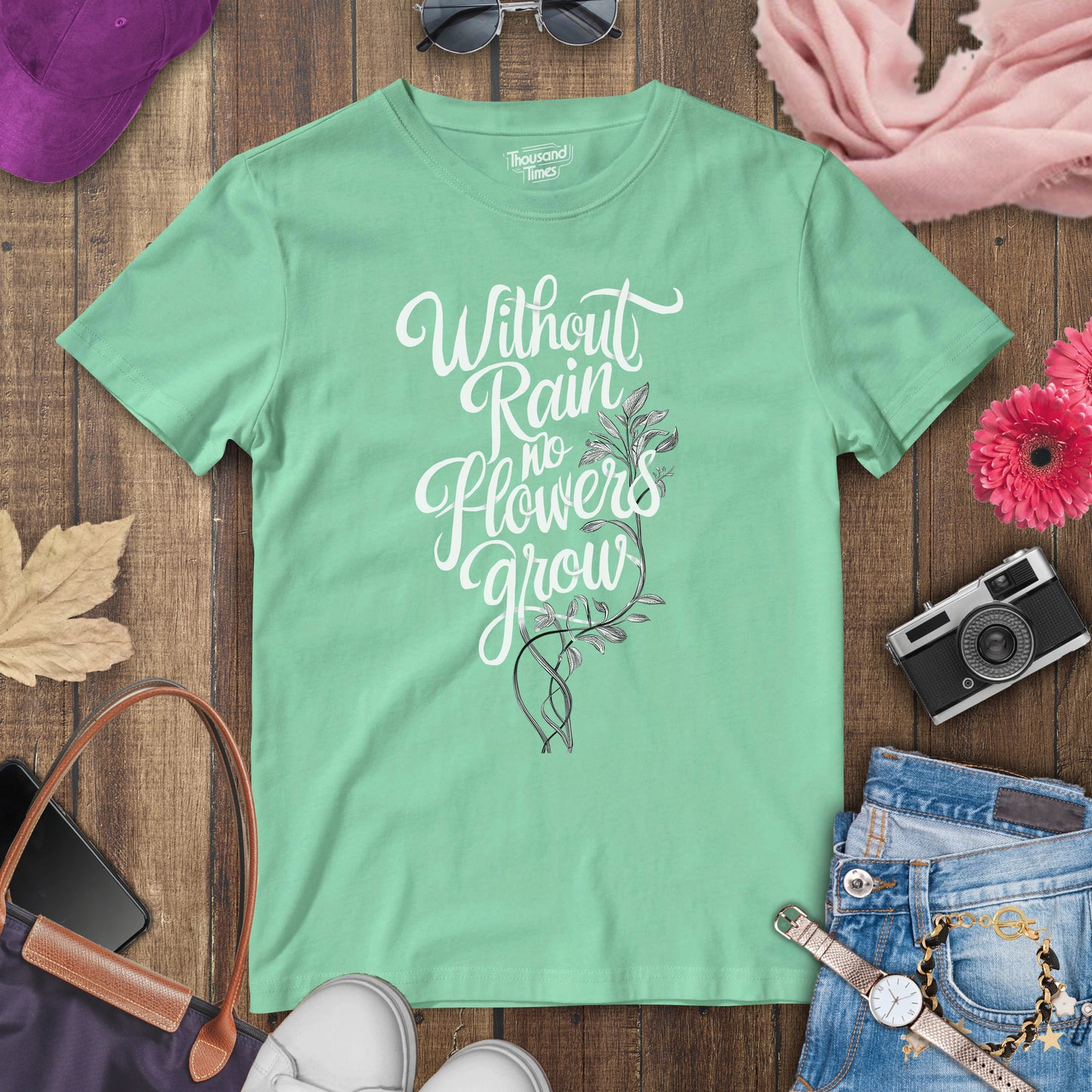 "Without rain no flowers grow" women's T-Shirt