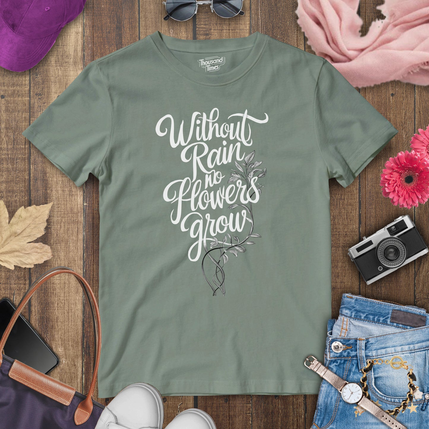 "Without rain no flowers grow" women's T-Shirt